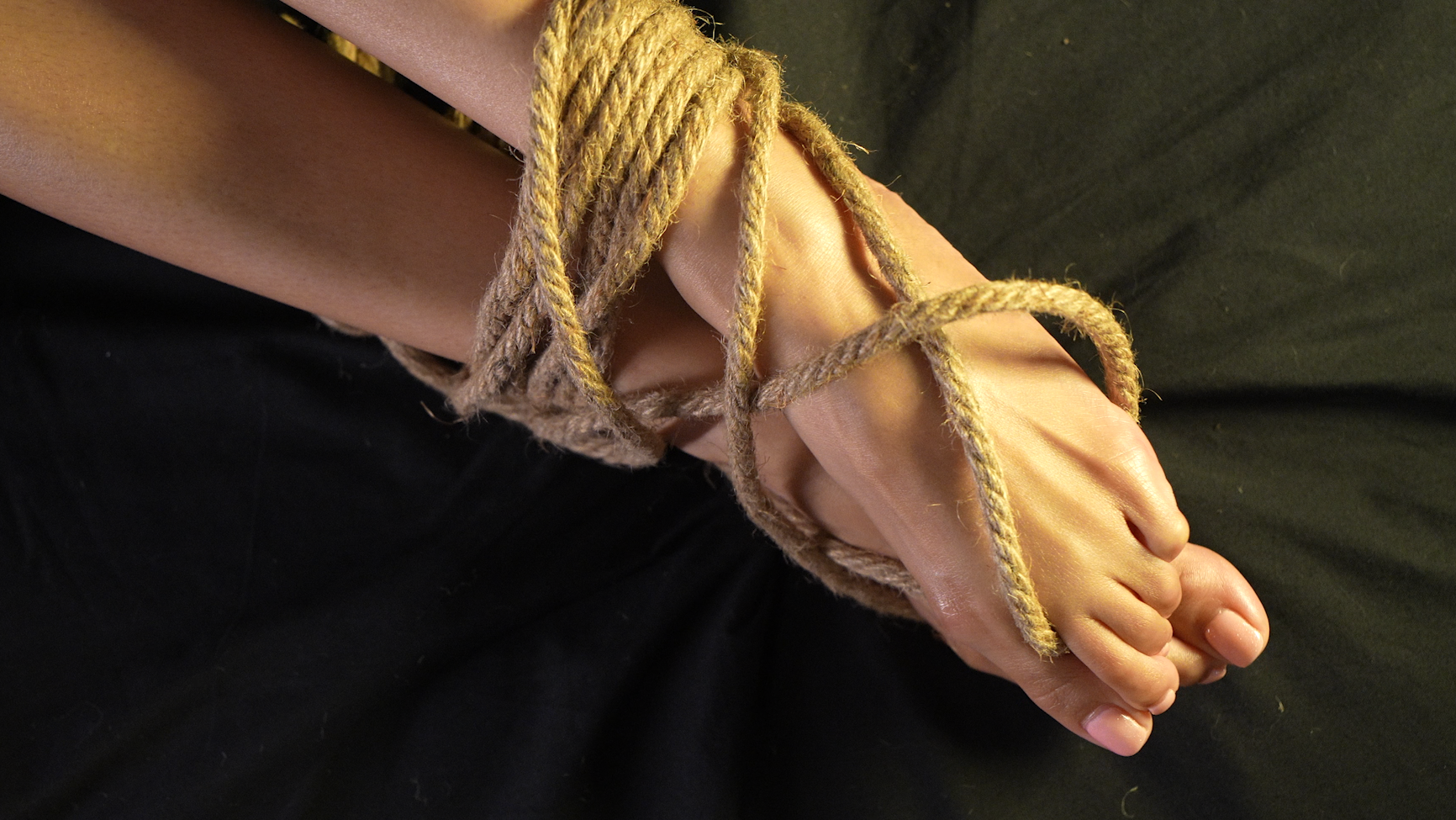 feet tied by rope